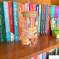 All Booked Up Glass Cans